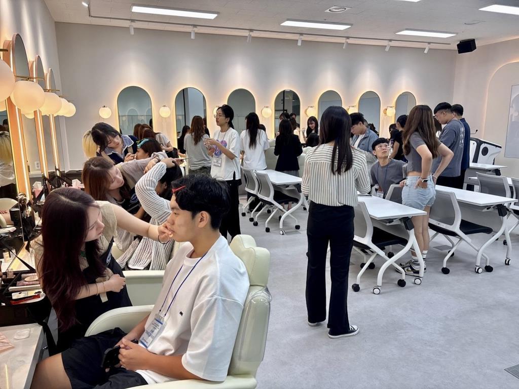 International beauty professionals attending a practical Korean beauty workshop