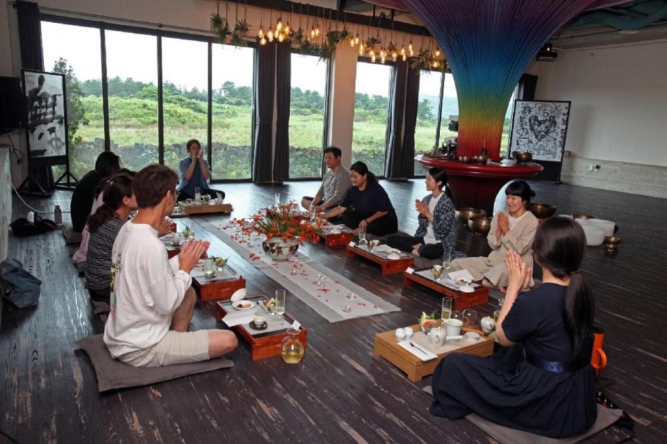 Participants joining a Korean tea ceremony