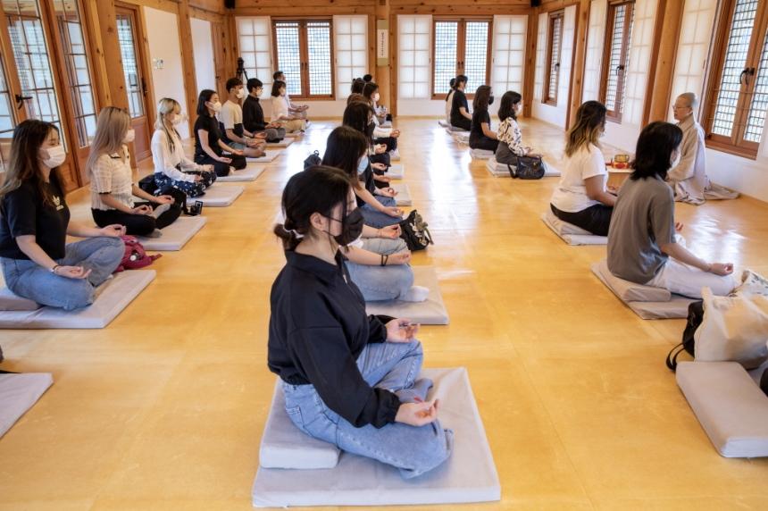 Group meditation in a Korean traditional wooden hall